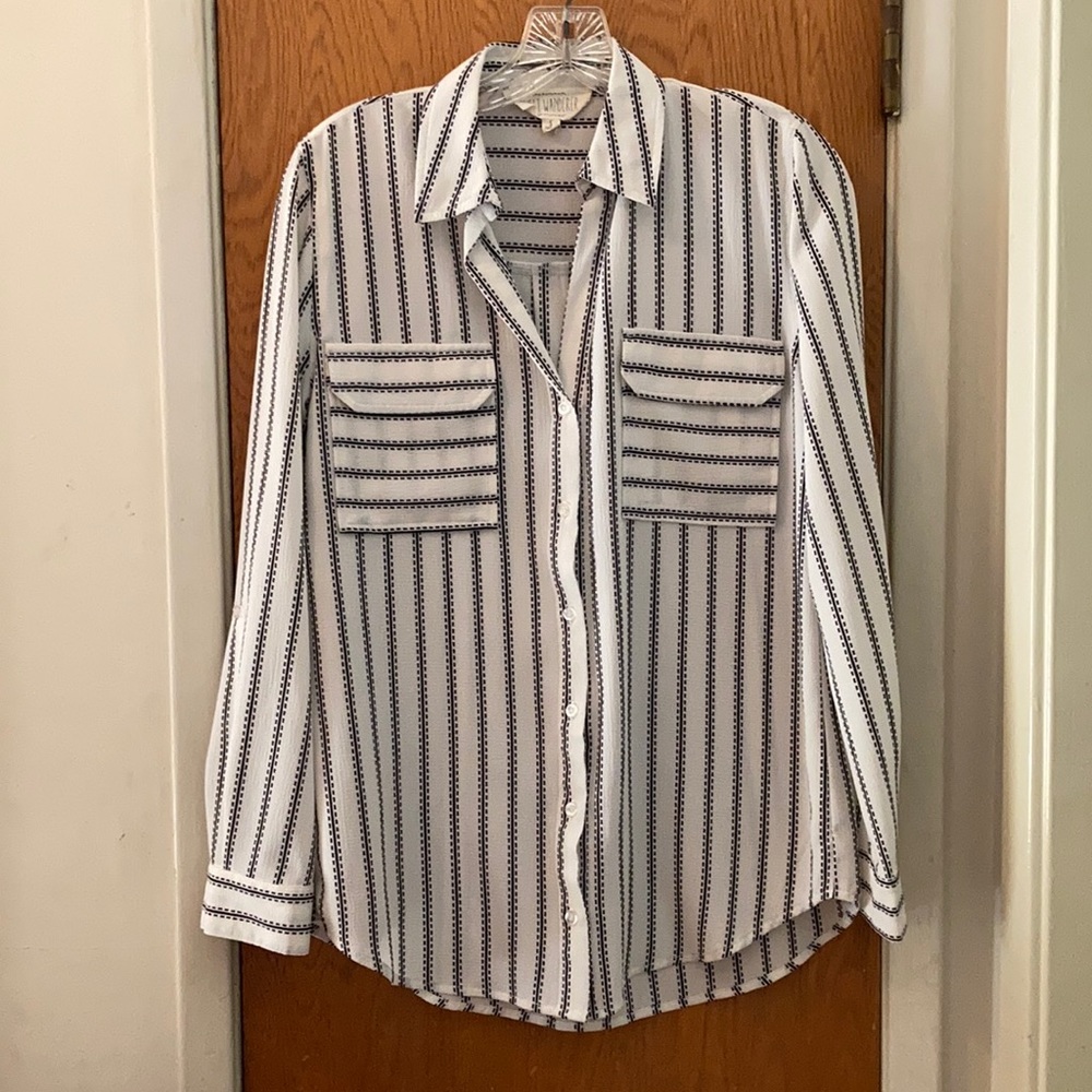 Long sleeved cream colored work blouse